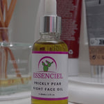 Woman applying organic prickly pear seed oil to face for nighttime hydration and anti-aging benefits